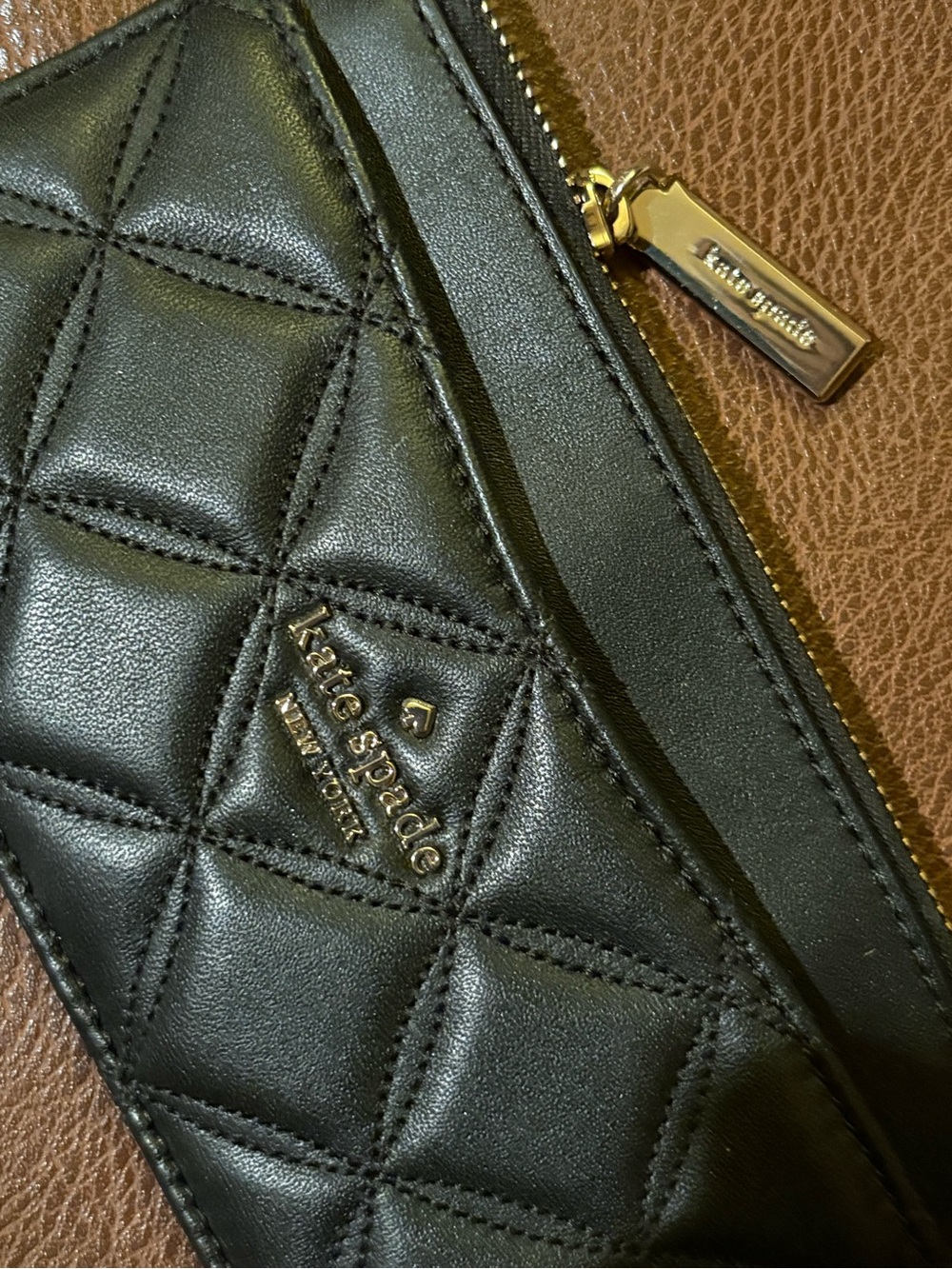 kate spade black quilted leather zip-around wallet with gold hardware